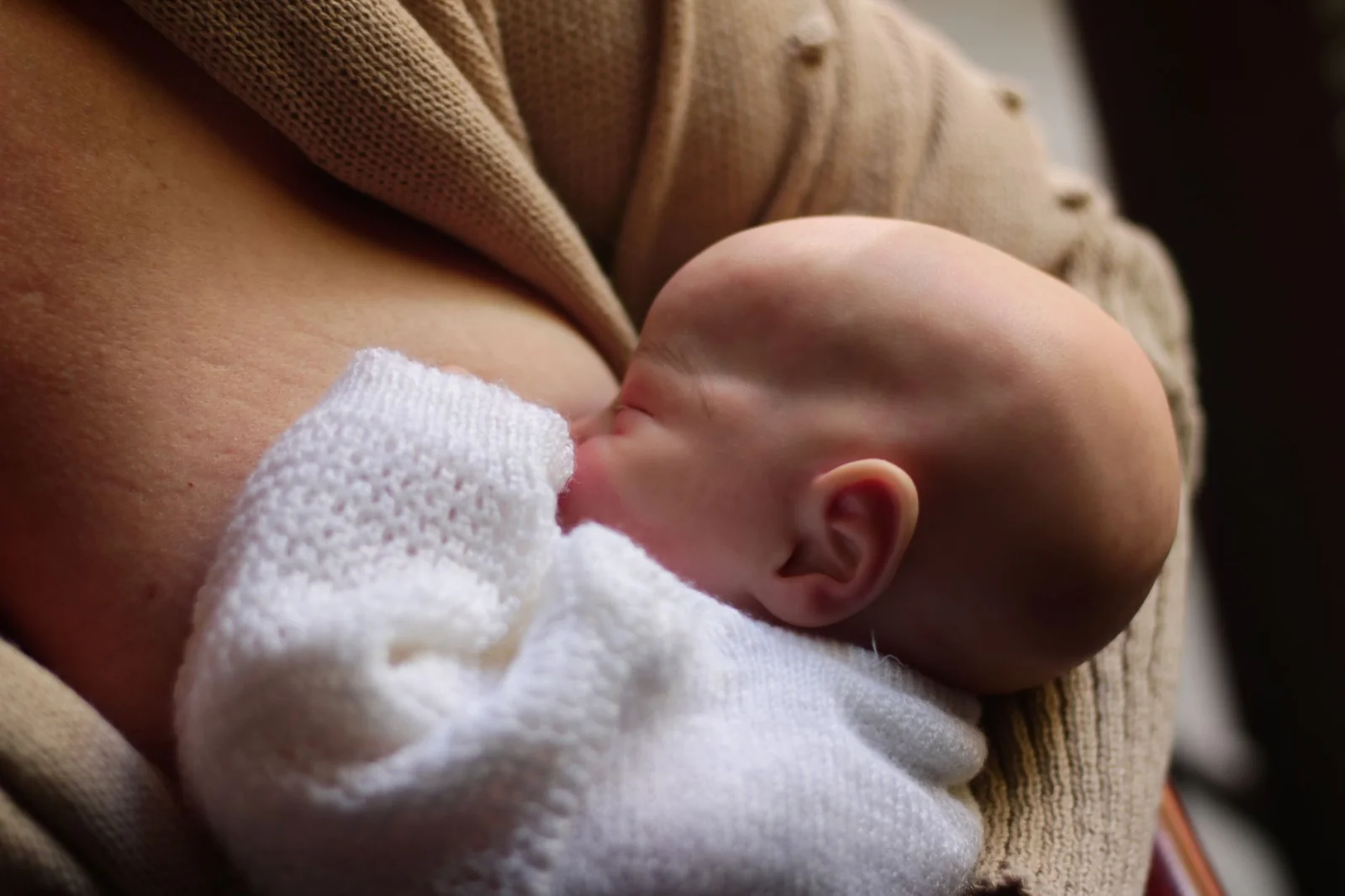 Why is breastfeeding still controversial in society?